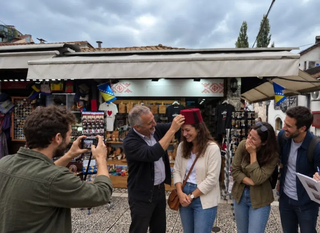Colleagues in Baščaršija laughing as one puts a red fez on a teammate while another takes a photo