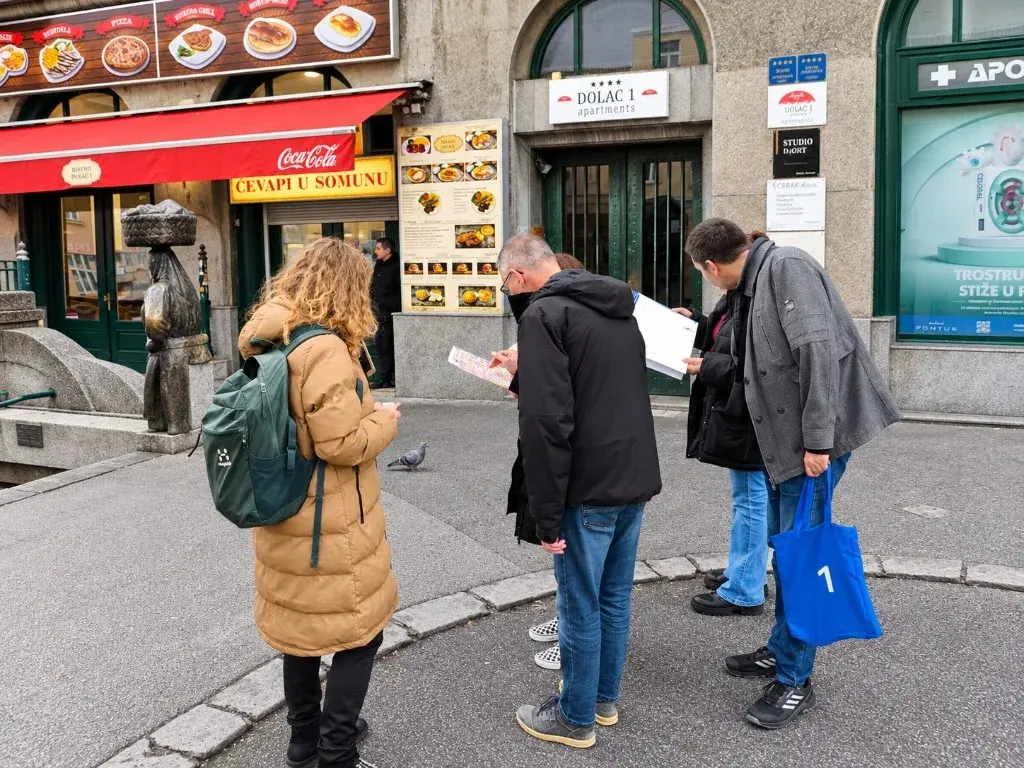 A group reading their clues and map together on a busy Old Town street corner